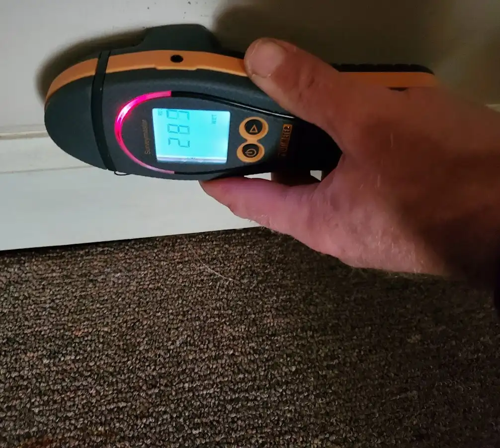 Moisture detection at baseboard during Storm Damage Restoration in Golden Valley